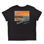 Black t-shirt with a graphic of a lighthouse and beach scene, featuring 'Santa Cruz California'.