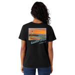Person wearing a black t-shirt with a scenic design and 'Santa Cruz California' text on the back.