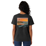 Person wearing a black t-shirt with a scenic design and 'Santa Cruz California' text on the back.