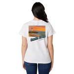 Person wearing a white t-shirt with a scenic print and 'Santa Cruz California' text on the back.