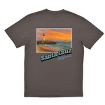 Gray t-shirt with a scenic print of a lighthouse and sunset over water on a white background