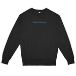 Black sweatshirt with 'Desert of His Dreams' text on a white background