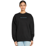 Person wearing a black sweatshirt with text on a white background