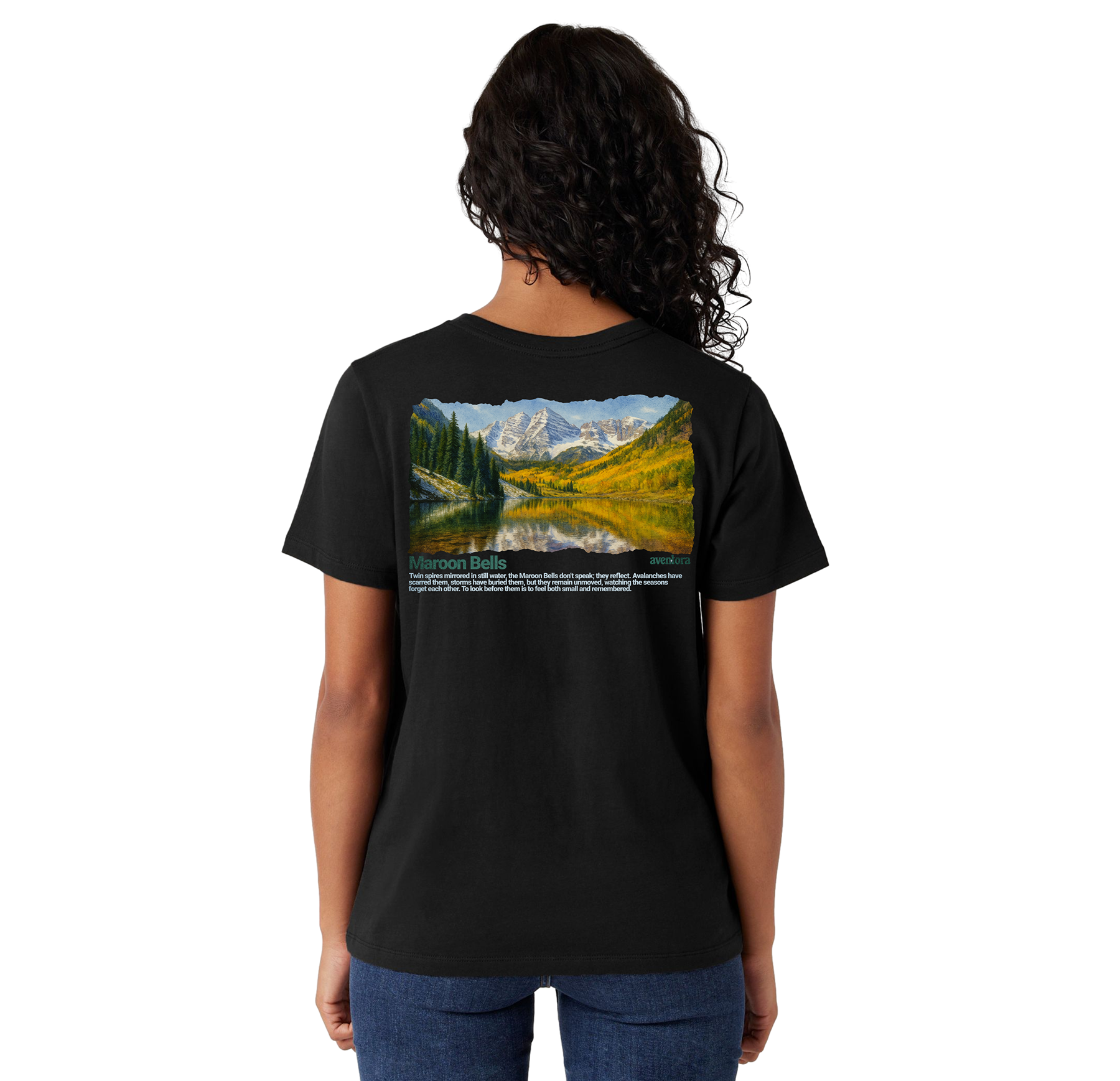 Person wearing a black t-shirt with a scenic design on the back