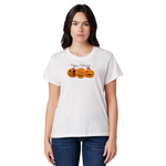 Woman wearing a white t-shirt with Halloween pumpkins design on a white background