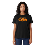 Woman wearing a black t-shirt with Halloween design on a white background