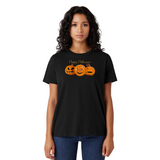 Woman wearing a black t-shirt with Halloween design on a white background
