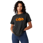 Person wearing a black t-shirt with Halloween-themed design on a white background