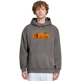 Person wearing a gray hoodie with Halloween-themed design on a white background