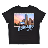 Black t-shirt with a graphic of Chicago skyline and 'Chicago Illinois' text on a white background