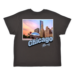 Black t-shirt with a graphic of Chicago skyline and 'Chicago Illinois' text on a white background