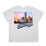 White t-shirt with a graphic of Chicago skyline and Cloud Gate sculpture on a white background