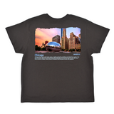 Black t-shirt with a graphic of the Chicago skyline and Bean sculpture on a white background
