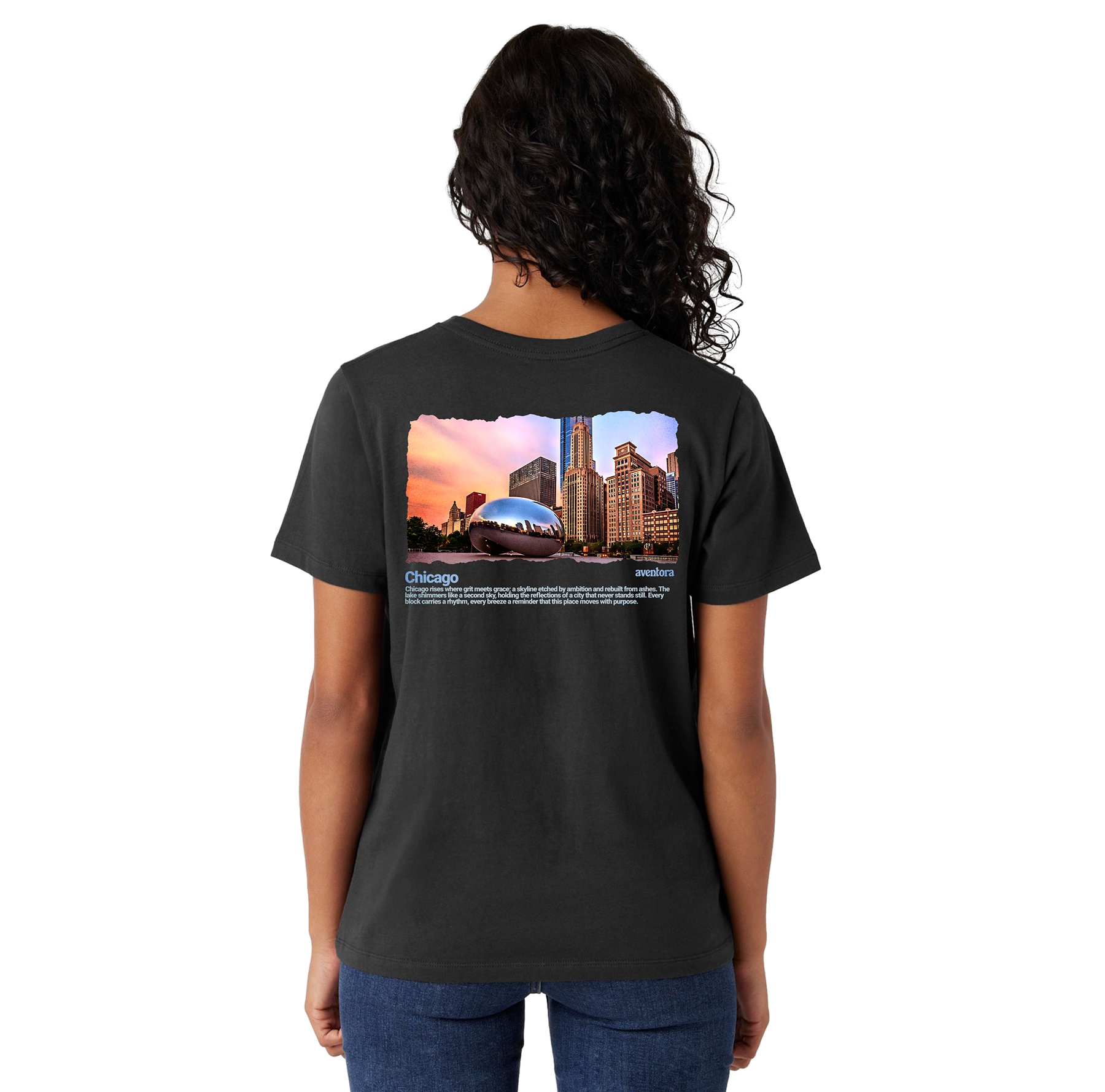 Person wearing a black t-shirt with a scenic print on the back, standing against a white background.