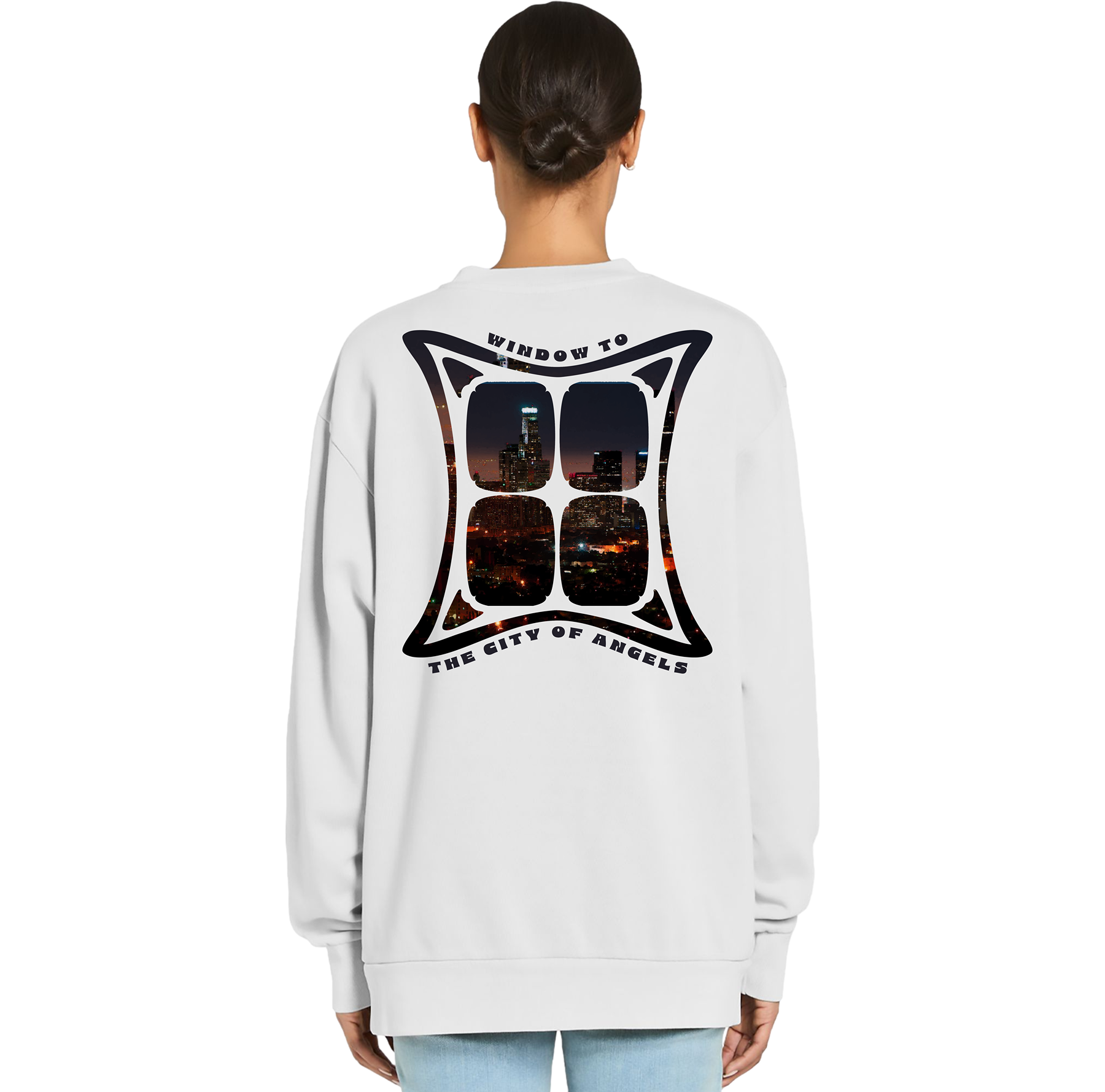 Person wearing a white sweatshirt with a graphic design on the back, standing against a white background