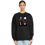 Black sweatshirt with a cityscape design featuring a heart and letter 'L' worn by a person on a white background