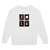 White sweatshirt with a graphic design on the chest featuring four cityscape images and a heart.