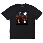 Black t-shirt with a cityscape design featuring the letters 'I' and 'A' on a white background