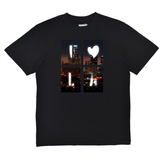 Black t-shirt with a cityscape design featuring the letters 'I' and 'A' on a white background