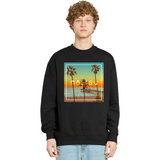Person wearing a black sweatshirt with a Malibu design on a white background