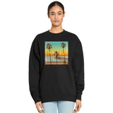 Black sweatshirt with Malibu graphic design worn by a person on a white background