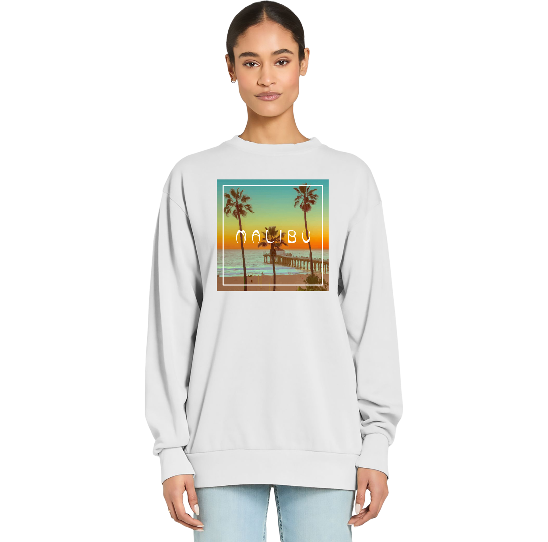 Person wearing a light gray sweatshirt with a Malibu graphic design on a white background