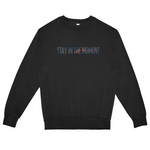 Black sweatshirt with 'STAY IN THE MOMENT' text on a white background