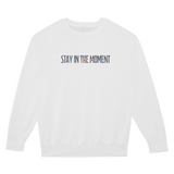 White sweatshirt with 'Stay in the Moment' text on a white background