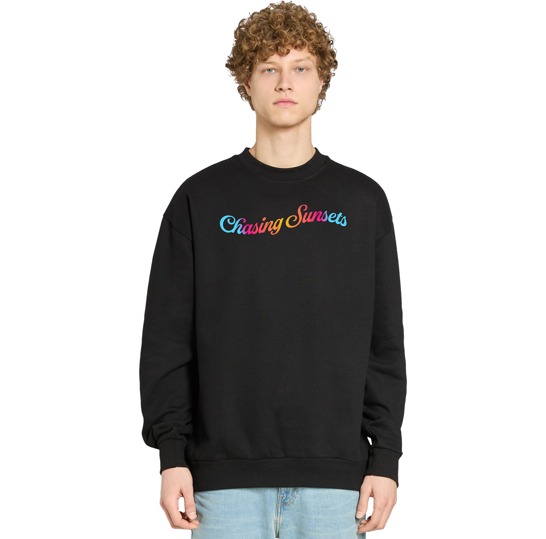 Person wearing a black sweatshirt with 'Chasing Sunsets' text in colorful letters on a white background
