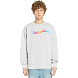 Person wearing a light gray sweatshirt with colorful text on a white background