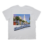 White t-shirt with a scenic print of Charleston, South Carolina on a white background
