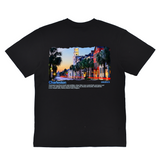 Black t-shirt with a colorful graphic of a city street and text on a white background