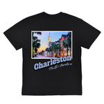 Black t-shirt with a graphic of Charleston, South Carolina and a scenic street view.