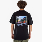 Person wearing a black t-shirt with 'Charleston, South Carolina' on the back