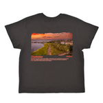 Black t-shirt with a scenic print of Charleston on a white background
