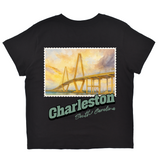 Black t-shirt with a bridge graphic and 'Charleston, South Carolina' text on a white background