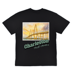 Black t-shirt with a bridge graphic and 'Charleston, South Carolina' text on a white background