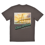 Gray t-shirt with a bridge graphic and 'Charleston, South Carolina' text on the back.