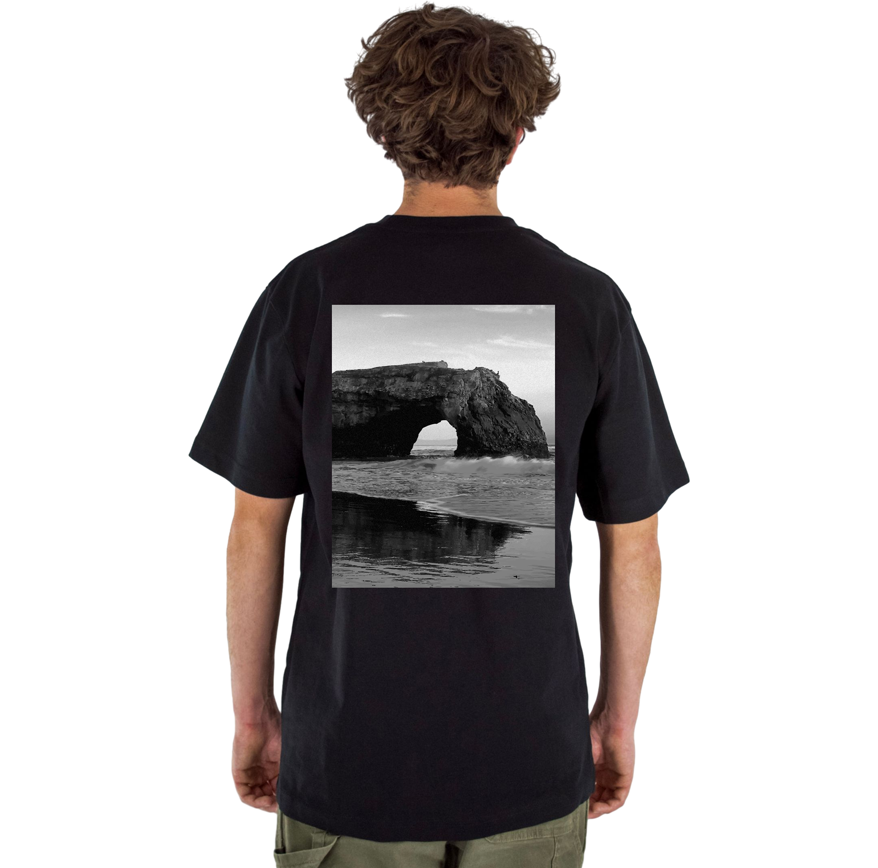 Person wearing a black t-shirt with a scenic print on the back