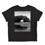 Black t-shirt with a graphic of a coastal arch on a white background