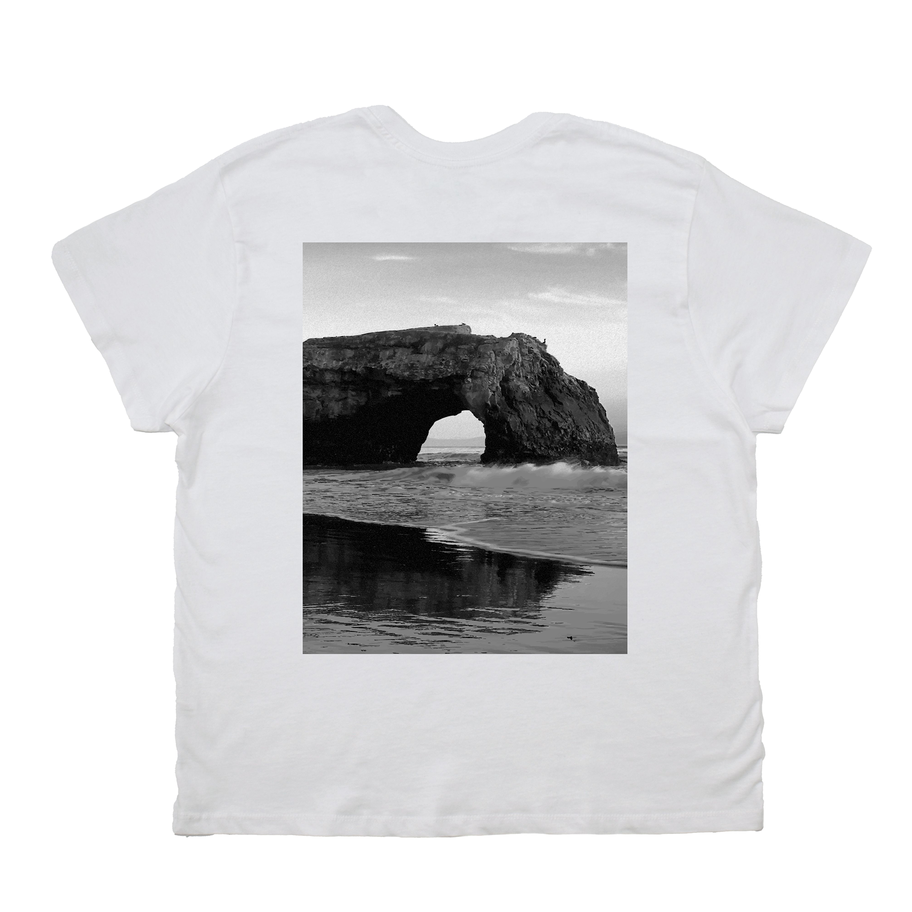 White t-shirt with a black and white photo of a coastal arch on the back