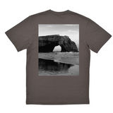 Gray t-shirt with a black and white photo of a coastal arch on the back