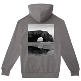 Gray hoodie with a black and white photograph of a natural arch on the back, displayed on a white background.