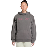 Person wearing a gray hoodie with pink text on a white background