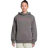 Person wearing a gray hoodie with pink text on a white background