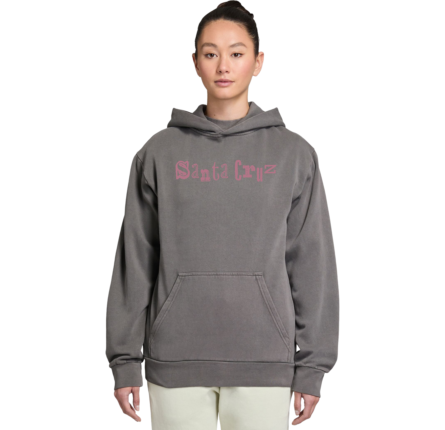 Person wearing a gray hoodie with pink text on a white background